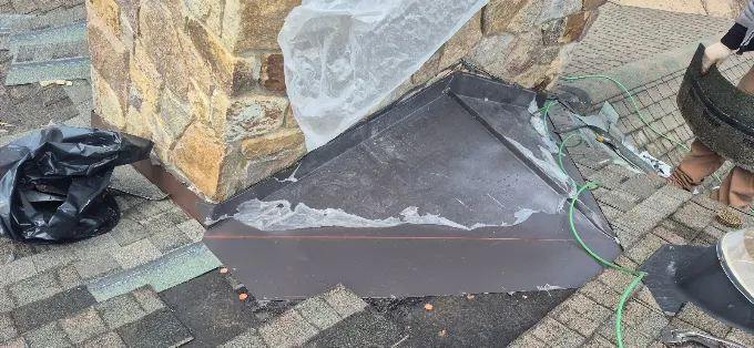 Chimney flashing at the roof line
