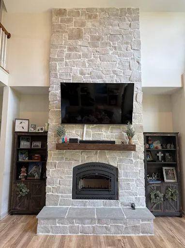 Whitewashed brick fireplace and insert
