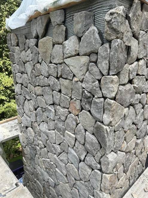 Dry-stack grey fieldstone, laid by hand