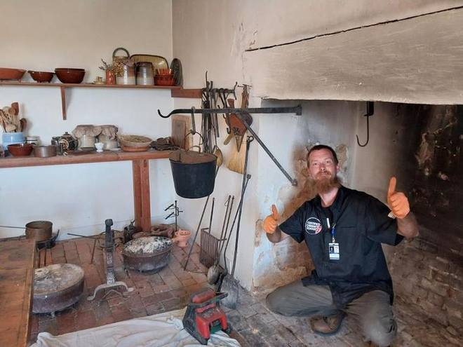 A colonial cooking hearth, swept and inspected