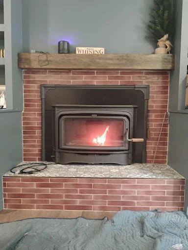 Wood insert  brick hearth, rustic beam