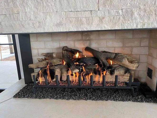 Linear gas log set  limestone surround