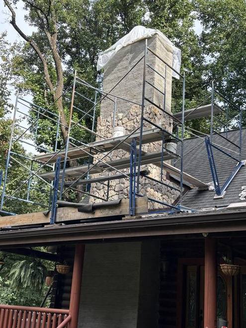 Chimney rebuild on a log home