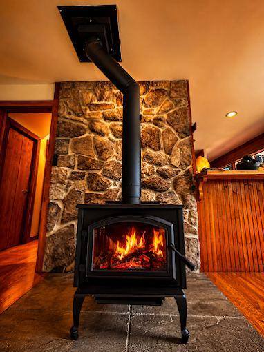 Wood stove install  stone wall