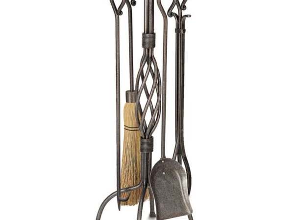 Fireplace tool set on a hearth